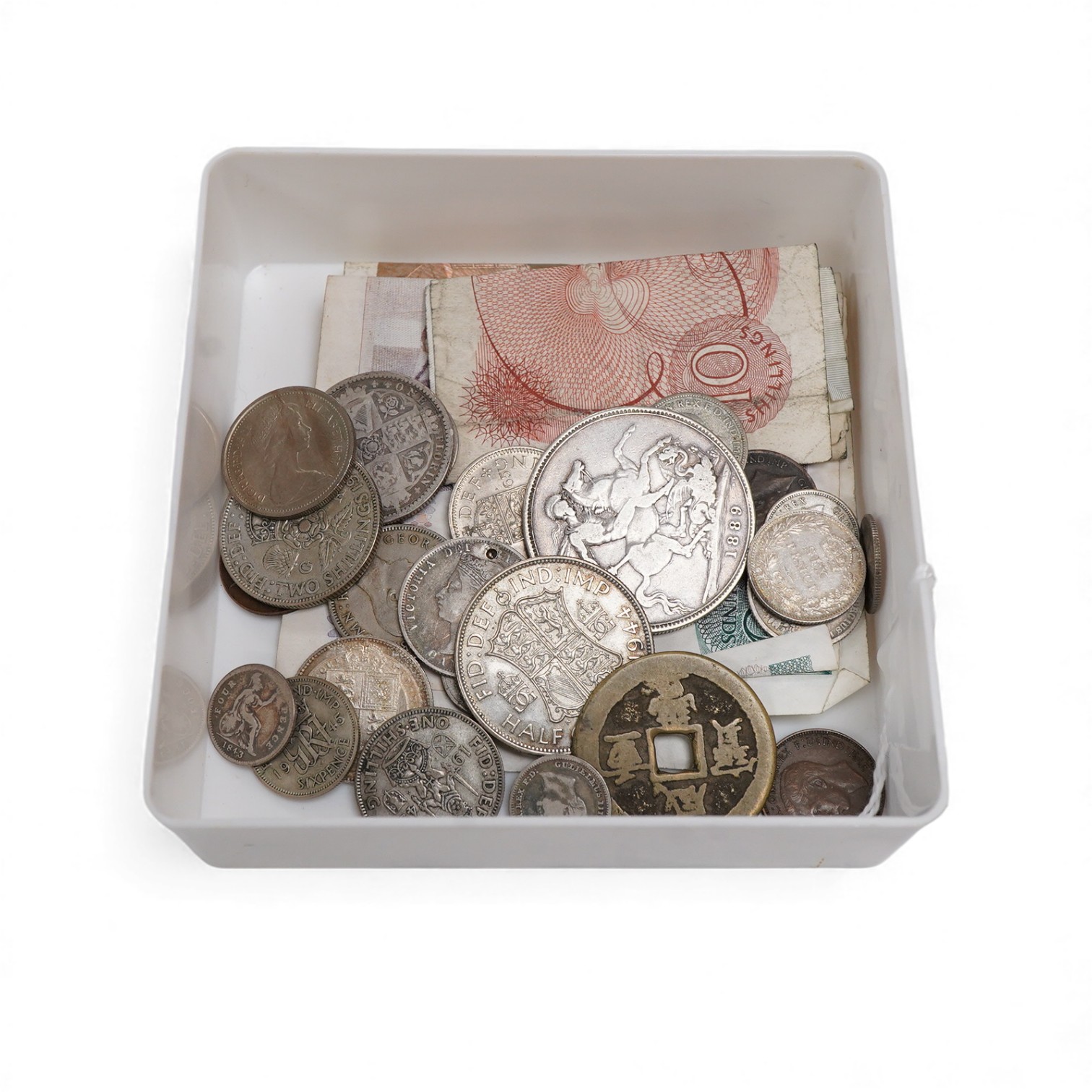 A collection of various banknotes and coins